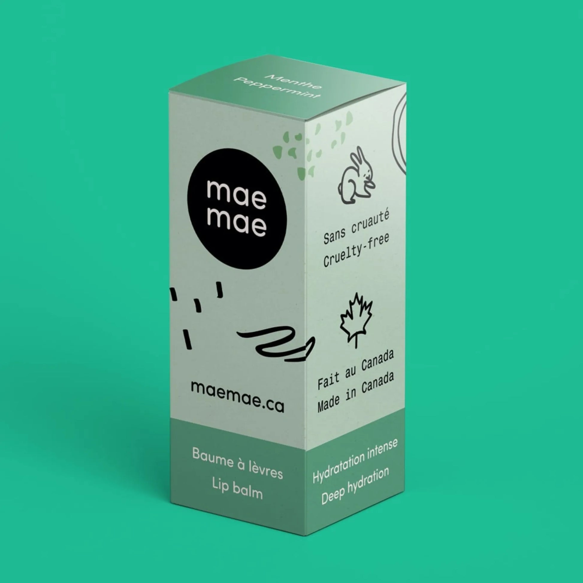 Boîte du baume à lèvres naturel à la menthe mae mae sur fond vert